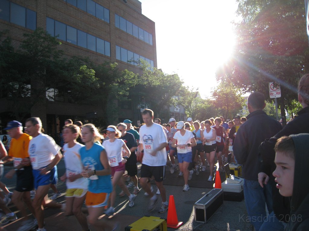 Tortoise_Hare_5K_08 135.jpg - The sun at their backs, just over the horizon now, everyone is hitting their stop watches as they cross over the timing mats.